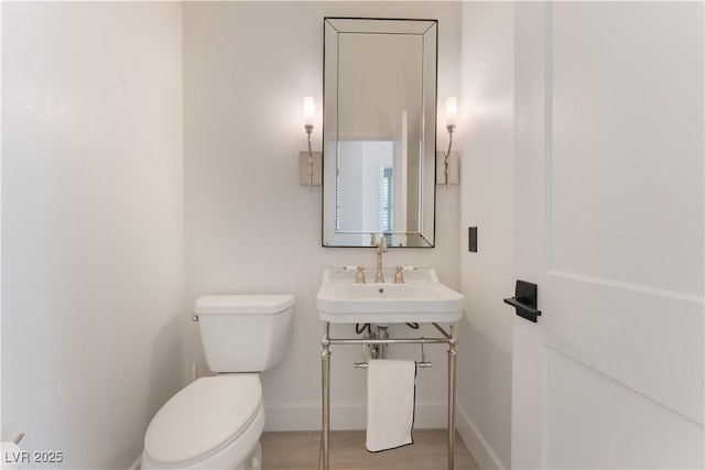 8504 Mystic Night Ave, Las Vegas, NV 89143 - bathroom featuring toilet, a sink, and baseboards