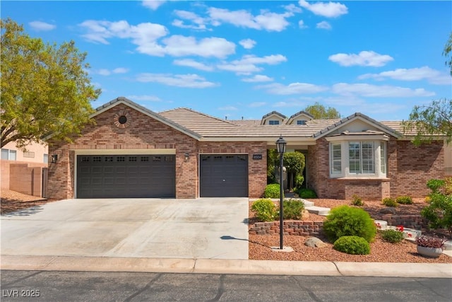 8504 Mystic Night Ave, Las Vegas, NV 89143 - view of front facade with an attached garage, driveway, brick siding, and a tile roof