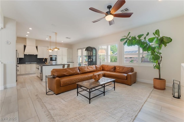 8504 Mystic Night Ave, Las Vegas, NV 89143 - living area featuring ceiling fan, baseboards, and recessed lighting