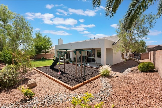 8504 Mystic Night Ave, Las Vegas, NV 89143 - back of property featuring a fenced backyard, stucco siding, a patio area, and a chimney