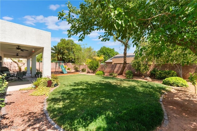 8504 Mystic Night Ave, Las Vegas, NV 89143 - view of yard with a ceiling fan, a playground, and a patio