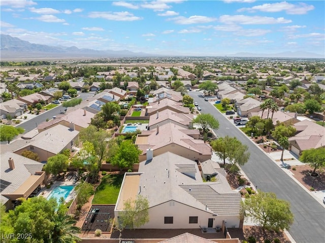 8504 Mystic Night Ave, Las Vegas, NV 89143 - aerial perspective of suburban area with mountains and a pool area