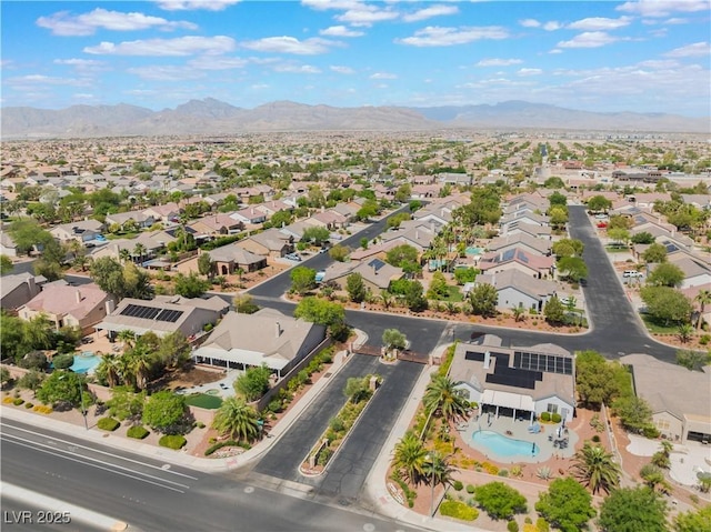8504 Mystic Night Ave, Las Vegas, NV 89143 - aerial view of residential area with a mountainous background and a pool area