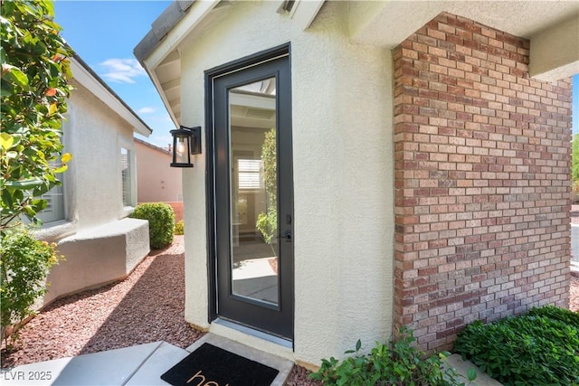8504 Mystic Night Ave, Las Vegas, NV 89143 - property entrance featuring stucco siding and brick siding