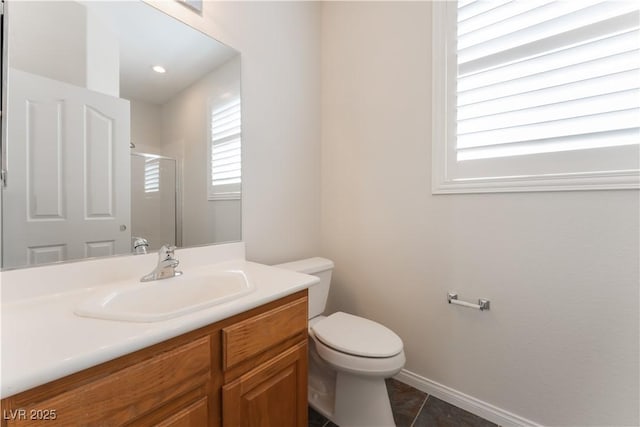 8504 Mystic Night Ave, Las Vegas, NV 89143 - full bath featuring toilet, vanity, baseboards, a shower with door, and tile patterned flooring