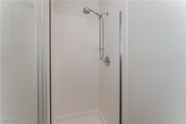 8504 Mystic Night Ave, Las Vegas, NV 89143 - full bathroom featuring a stall shower and a textured wall