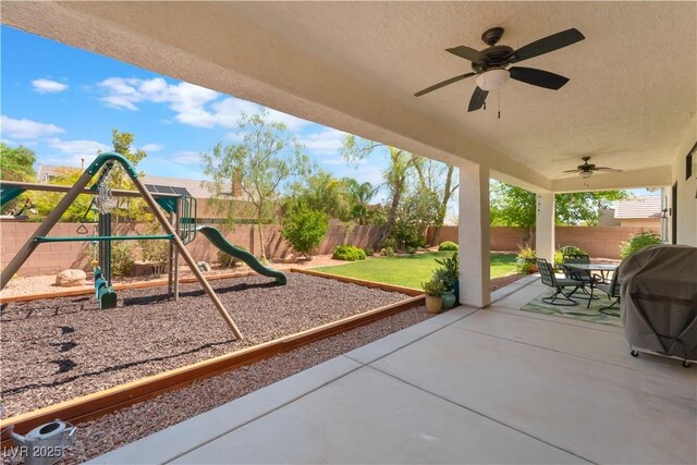 8504 Mystic Night Ave, Las Vegas, NV 89143 - view of patio / terrace featuring a ceiling fan, a grill, and outdoor dining space