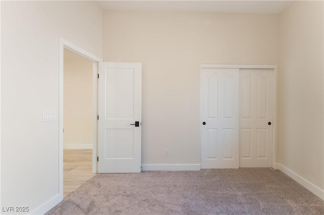 8504 Mystic Night Ave, Las Vegas, NV 89143 - unfurnished bedroom featuring carpet floors, baseboards, and a closet
