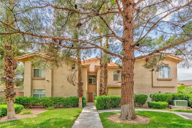 2050 W Warm Springs Rd Unit 312, Henderson, NV 89014 - view of front facade with stucco siding and a front lawn