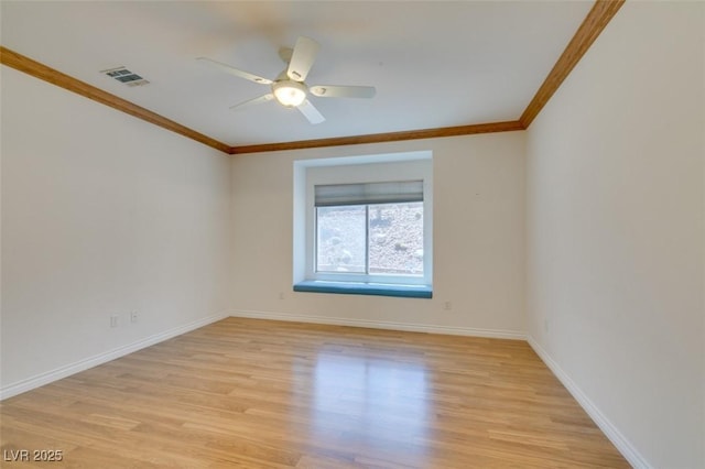 1793 Eagle Village Ave, Henderson, NV 89012 - unfurnished room featuring crown molding, light wood-style flooring, baseboards, and a ceiling fan