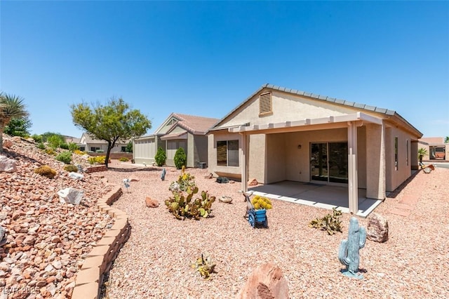 1793 Eagle Village Ave, Henderson, NV 89012 - rear view of property with stucco siding and a patio area