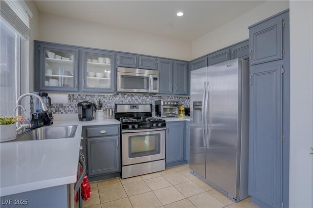 10605 Moon Flower Arbor Pl, Las Vegas, NV 89144 - kitchen featuring appliances with stainless steel finishes, a sink, light countertops, and recessed lighting