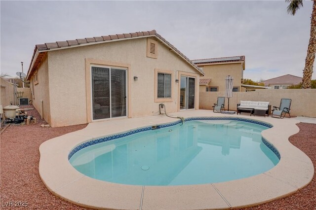 10605 Moon Flower Arbor Pl, Las Vegas, NV 89144 - view of pool featuring a patio, a fenced backyard, and an outdoor living space