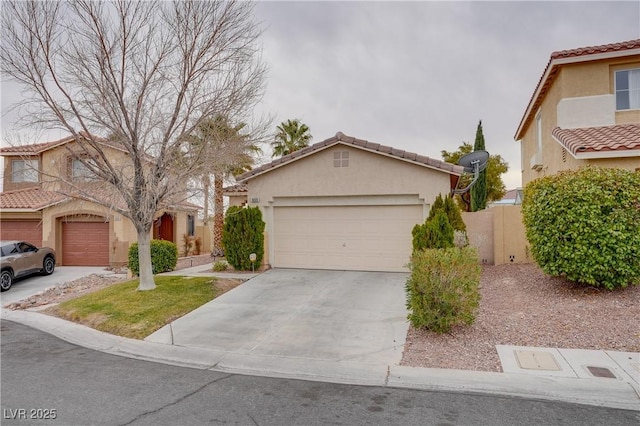 10605 Moon Flower Arbor Pl, Las Vegas, NV 89144 - view of front of property featuring concrete driveway, stucco siding, an attached garage, and a tile roof