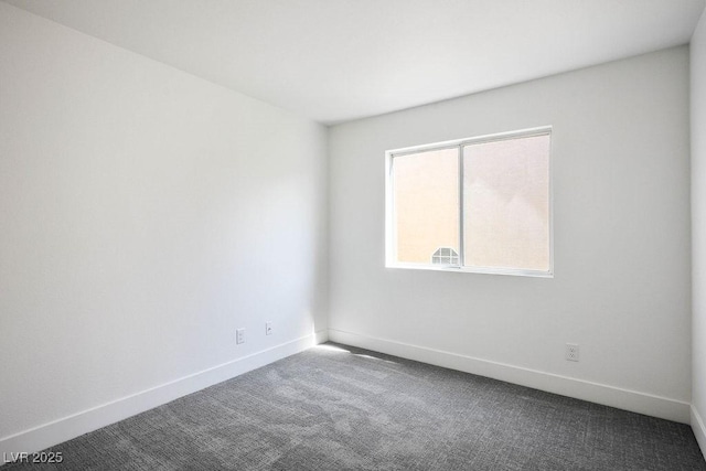 2316 Pine Bluff Ct, Las Vegas, NV 89134 - empty room with dark colored carpet and baseboards