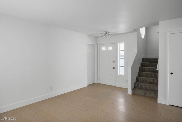 2316 Pine Bluff Ct, Las Vegas, NV 89134 - foyer entrance with stairs, wood finished floors, a chandelier, and baseboards