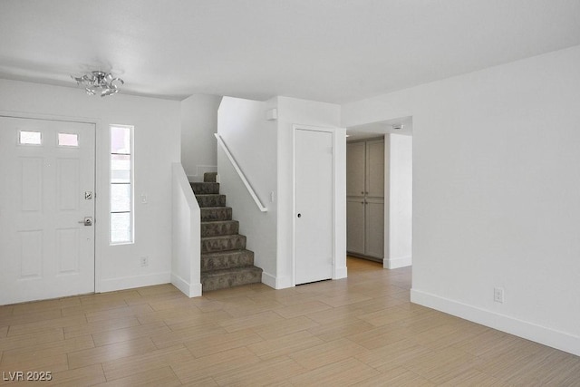 2316 Pine Bluff Ct, Las Vegas, NV 89134 - entrance foyer with stairway, baseboards, and light wood-style flooring