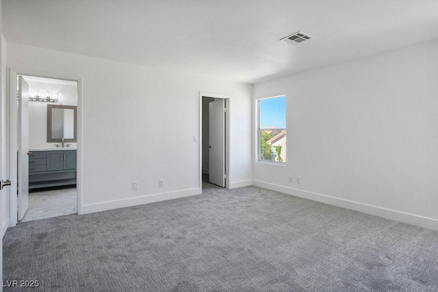 2316 Pine Bluff Ct, Las Vegas, NV 89134 - unfurnished bedroom featuring a sink, carpet flooring, baseboards, and ensuite bath