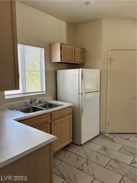 9000 Las Vegas Blvd Unit 2189, Las Vegas, NV 89123 - kitchen featuring freestanding refrigerator, a sink, light countertops, and light marble finish flooring