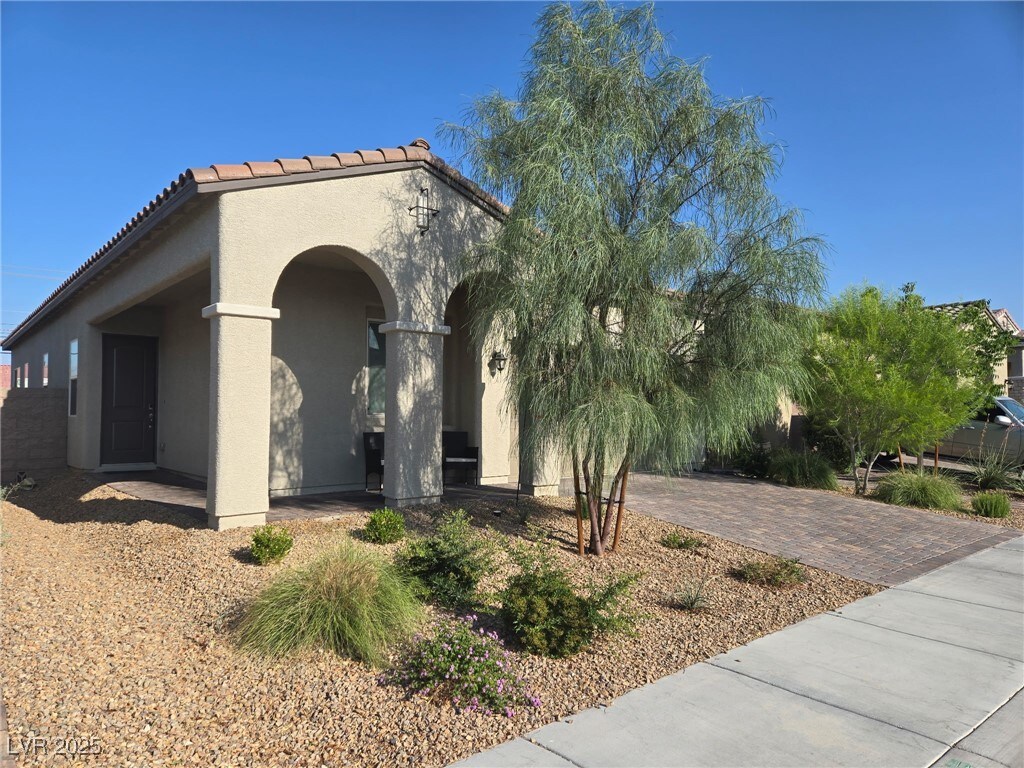 4719 N Transcendental St, North Las Vegas, NV 89031 - mediterranean / spanish house featuring stucco siding and a tile roof
