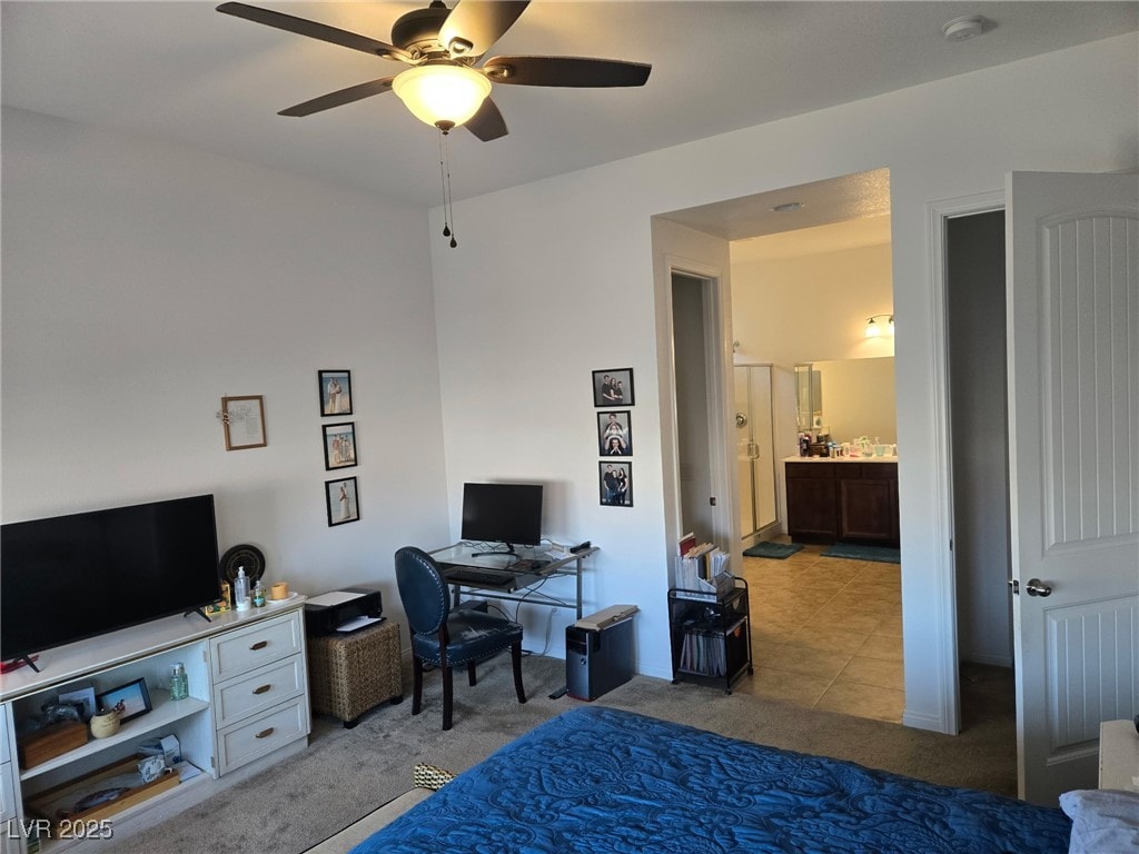 4719 N Transcendental St, North Las Vegas, NV 89031 - home office with light carpet, a ceiling fan, and light tile patterned flooring
