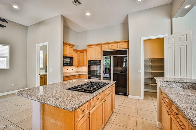 213 Villa Borghese St, Las Vegas, NV 89138 - kitchen with black appliances, baseboards, tasteful backsplash, light tile patterned floors, and healthy amount of natural light