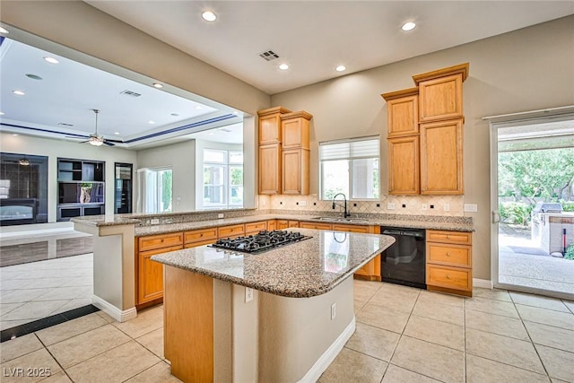 213 Villa Borghese St, Las Vegas, NV 89138 - kitchen featuring black dishwasher, a sink, gas cooktop, light tile patterned floors, and a peninsula