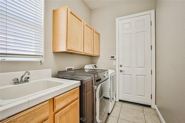 213 Villa Borghese St, Las Vegas, NV 89138 - washroom with cabinet space, washing machine and dryer, light tile patterned flooring, and baseboards