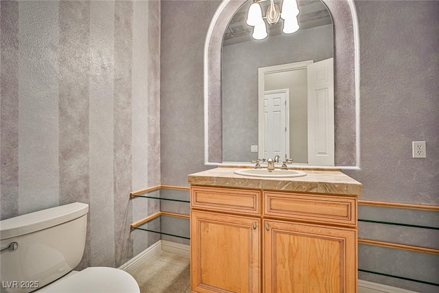213 Villa Borghese St, Las Vegas, NV 89138 - bathroom with toilet, a chandelier, vanity, and a textured wall