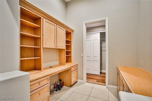 213 Villa Borghese St, Las Vegas, NV 89138 - unfurnished office featuring built in desk, light tile patterned floors, and baseboards