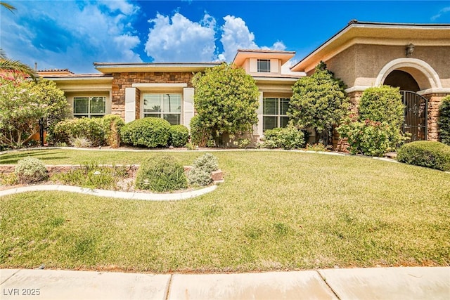 213 Villa Borghese St, Las Vegas, NV 89138 - view of front facade featuring stone siding, a front lawn, and stucco siding