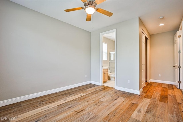 213 Villa Borghese St, Las Vegas, NV 89138 - unfurnished bedroom featuring baseboards, light wood-style flooring, ensuite bath, and ceiling fan
