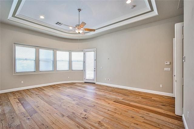 213 Villa Borghese St, Las Vegas, NV 89138 - empty room with a raised ceiling, a ceiling fan, light wood-style floors, baseboards, and crown molding