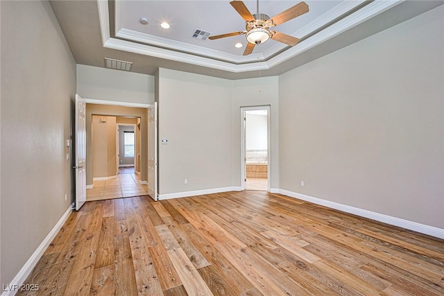 213 Villa Borghese St, Las Vegas, NV 89138 - spare room featuring crown molding, a tray ceiling, ceiling fan, light wood finished floors, and baseboards