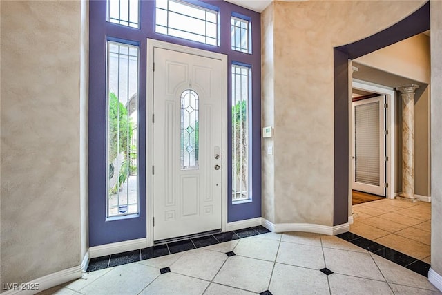 213 Villa Borghese St, Las Vegas, NV 89138 - tiled entryway with healthy amount of natural light, baseboards, a high ceiling, and inlaid floor details
