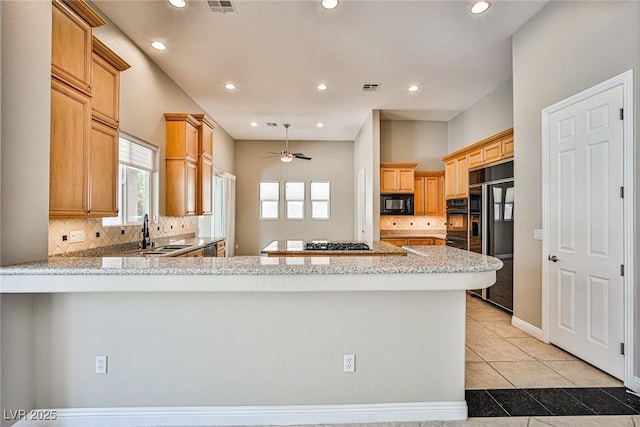 213 Villa Borghese St, Las Vegas, NV 89138 - kitchen with black appliances, a sink, backsplash, recessed lighting, and a peninsula