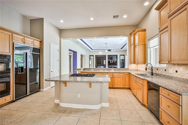 213 Villa Borghese St, Las Vegas, NV 89138 - kitchen with black appliances, a sink, recessed lighting, light tile patterned floors, and light stone countertops