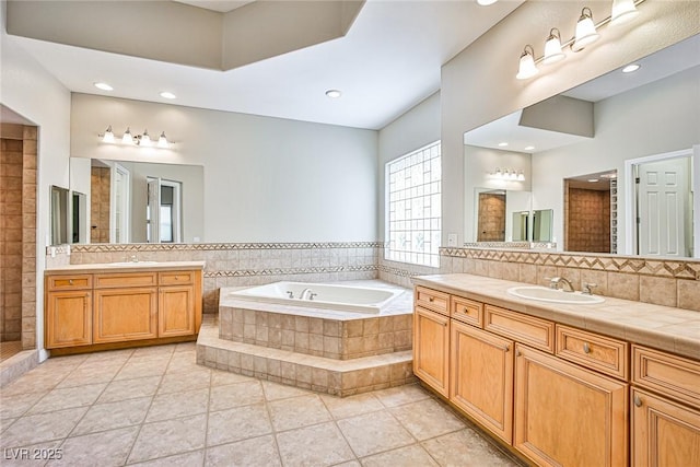 213 Villa Borghese St, Las Vegas, NV 89138 - bathroom with a bath, two vanities, tile patterned floors, decorative backsplash, and a tile shower