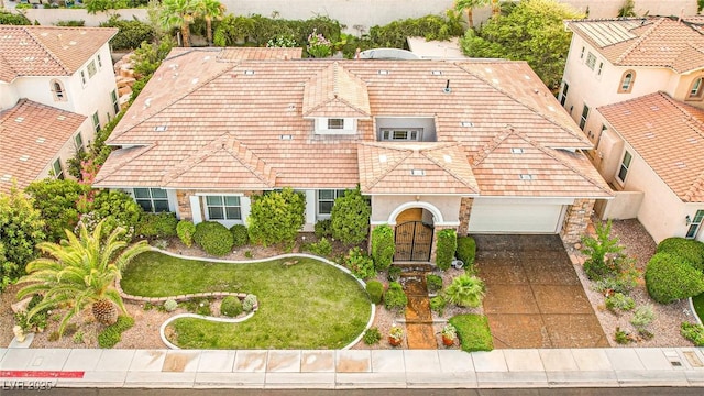 213 Villa Borghese St, Las Vegas, NV 89138 - view of front of house with driveway, stucco siding, a tile roof, stone siding, and a front yard