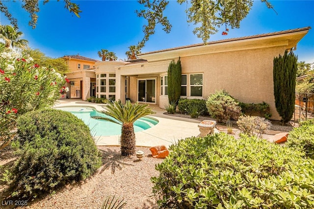 213 Villa Borghese St, Las Vegas, NV 89138 - rear view of property featuring stucco siding, an outdoor pool, and a patio