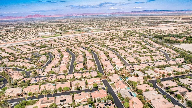 213 Villa Borghese St, Las Vegas, NV 89138 - aerial overview of property's location featuring a mountain backdrop and nearby suburban area