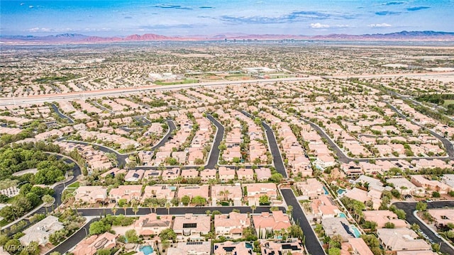 213 Villa Borghese St, Las Vegas, NV 89138 - aerial overview of property's location with a mountain backdrop and nearby suburban area