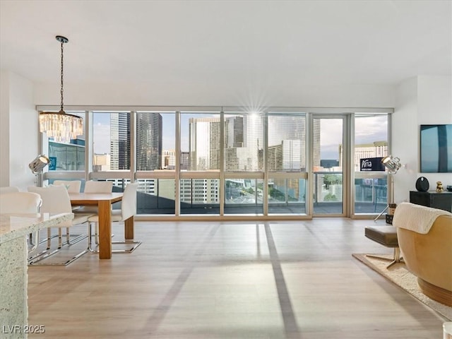 4471 Dean Martin Dr Unit 1109, Las Vegas, NV 89103 - dining area featuring wood finished floors and a chandelier