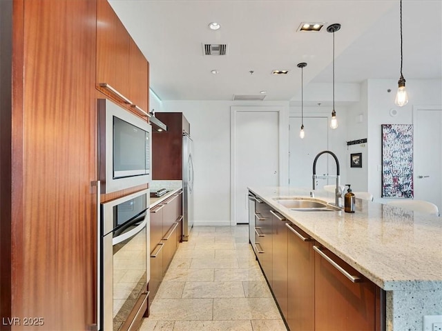 4471 Dean Martin Dr Unit 1109, Las Vegas, NV 89103 - kitchen featuring a sink, modern cabinets, stainless steel appliances, and a spacious island