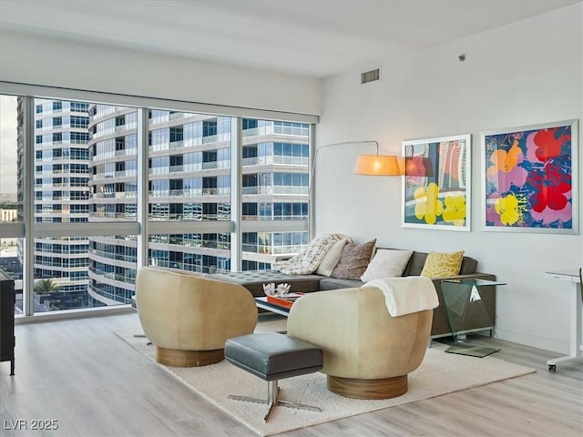 4471 Dean Martin Dr Unit 1109, Las Vegas, NV 89103 - living area with wood finished floors and plenty of natural light