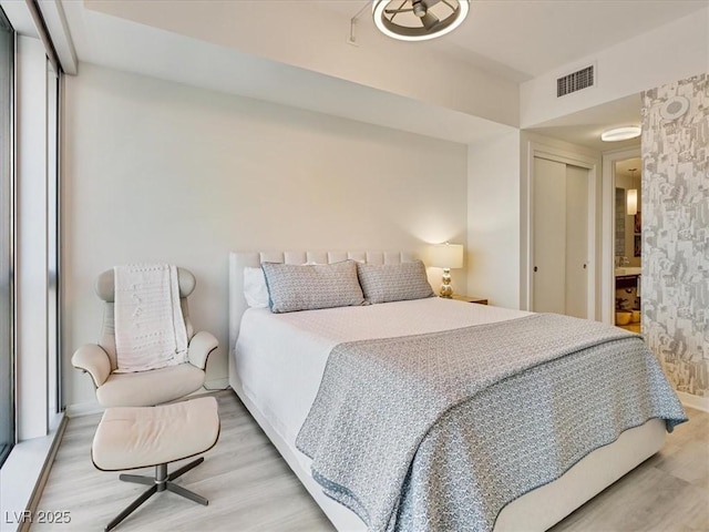 4471 Dean Martin Dr Unit 1109, Las Vegas, NV 89103 - bedroom with light wood-style floors, a closet, and baseboards