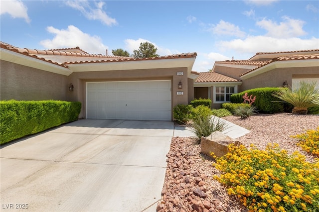1912 Summer Pine Ct Unit 102, Las Vegas, NV 89134 - mediterranean / spanish-style house with a garage, concrete driveway, stucco siding, and a tile roof
