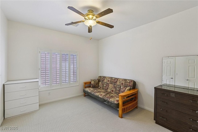 8224 Fowler Falls Ct, North Las Vegas, NV 89085 - living area featuring light carpet, ceiling fan, and baseboards
