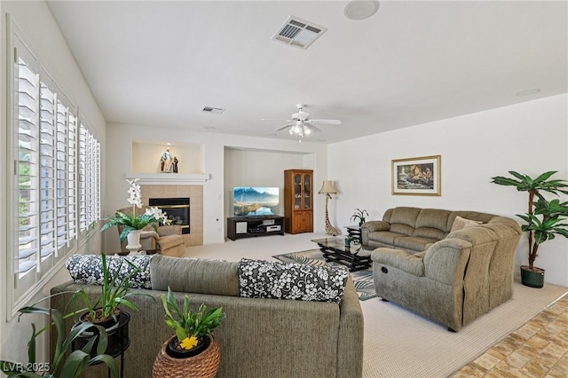 8224 Fowler Falls Ct, North Las Vegas, NV 89085 - living room with a fireplace and a ceiling fan