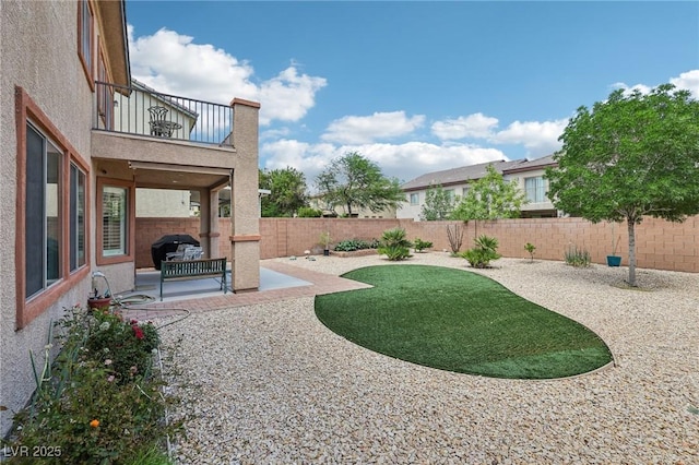 8224 Fowler Falls Ct, North Las Vegas, NV 89085 - fenced backyard featuring a balcony and a patio area